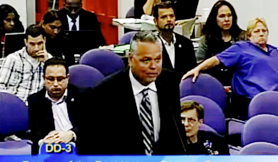 FILE - In this Feb. 18, 2015, file image from video from a Broward County Public Schools meeting school resource officer Scot Peterson  addresses the panel. Peterson is scheduled to testify Wednesday. Oct. 10, 2018, during the second day of this month&#39;s three-day hearing of the Marjory Stoneman Douglas High School Public Safety Commission. (Broward County Public Schools via AP, File)