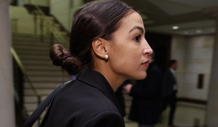 Rep.-elect Alexandria Ocasio-Cortez, D-N.Y., walks to member-elect briefings on Capitol Hill in Washington, Thursday, Nov. 15, 2018. (AP Photo/Carolyn Kaster)