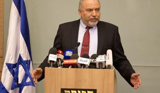 Israeli Defense Minister Avigdor Lieberman delivers a statement at the Knesset, Israel&#39;s Parliament, in Jerusalem, Wednesday, Nov. 14, 2018. Lieberman announced his resignation Wednesday over the Gaza cease-fire, making early elections likely. (AP Photo/Ariel Schalit)