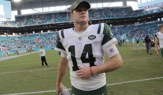 FILE - In this Sunday, Nov. 4, 2018, file photo, New York Jets quarterback Sam Darnold (14) walks off the field after an NFL football game against the Miami Dolphins, in Miami Gardens, Fla. The Jets have six games left and will be hard-pressed to even match the 5-11 records they put up in each of the last two seasons. New York has two games against New England, including a home matchup out of the break, and meetings with Tennessee, Buffalo, Houston and Green Bay _ no gimmes in the bunch.  Darnold is still considered the future of the franchise, no matter how much he struggles this season. (AP Photo/Lynne Sladky, FIle)