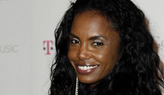 This Nov. 16, 2011, file photo shows Kim Porter arriving at the Google and T-Mobile party celebrating the launch of Google Music, in Los Angeles. Porter, Diddy&#39;s former longtime girlfriend and the mother of three of his children, has died. A representative for Sean &amp;quot;Diddy&amp;quot; Combs confirmed the death of the 47-year-old on Thursday, Nov. 15, 2018. No further details were immediately available.  (AP Photo/Matt Sayles, File)
