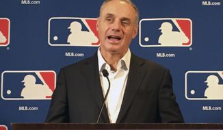 Major League Baseball commissioner Rob Manfred speaks at the baseball owners meeting in Atlanta, Thursday, Nov. 15, 2018. (AP Photo/Paul newberry)