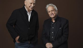 In this Nov. 7, 2018 photo, Alan Arkin, left, and Michael Douglas, cast members in the Netflix comedy series &amp;quot;The Kominsky Method,&amp;quot; pose for a portrait at the Beverly Wilshire Four Seasons hotel in Beverly Hills, Calif. The pair play Hollywood veterans facing the indignities of aging in a change-of-pace comedy-drama from sitcom hitmaker Chuck Lorre. (Photo by Chris Pizzello/Invision/AP)