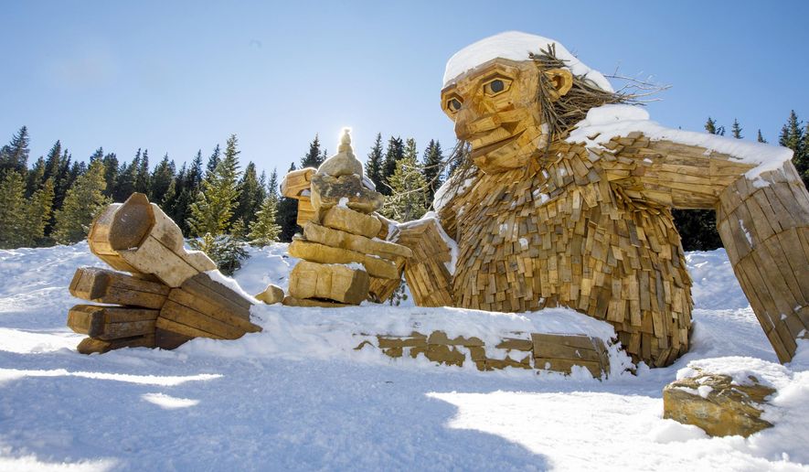The large wooden troll, &amp;quot;Isak Hearthstone,&amp;quot; made by artist Thomas Dambo during Breckenridge International Festival of the Arts in August, sits in the snow Wednesday, Nov. 14, 2018, along the Wellington Trail in Breckenridge, Colo. The troll was created during the Breckenridge Festival of the Arts in August, but got so popular that it caused complaints from nearby homeowners due to tourists visiting, and demanded it to be removed.  (Hugh Carey/Summit Daily News via AP)