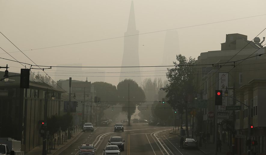 The Transamerica Pyramid is obscured by smoke and haze from wildfires Friday, Nov. 16, 2018, in San Francisco. (AP Photo/Eric Risberg)