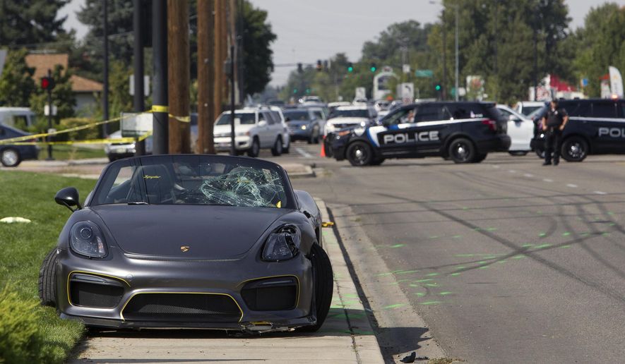 FILE--In this Sept. 16, 2017, file p photo, police block off the scene where the driver of a Porsche injured eight bystanders after losing control of the sports car near the Boise Spectrum 21 theaters in Boise, Idaho. The driver of the Porsche has been sentenced to 180 days in jail with all but seven days suspended.(Darin Oswald/Idaho Statesman via AP, file