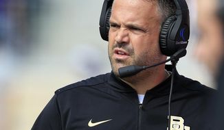 FILE - In this Sept. 30, 2017, file photo, Baylor head coach Matt Rhule watches from the sideline during the first half of an NCAA college football game against Kansas State, in Manhattan, Kan. Baylor coach Matt Rhule is more interested in what his team and the seniors who stuck around can accomplish, and not what the Bears could do to Big 12 rival TCU in the process. (AP Photo/Orlin Wagner, File)