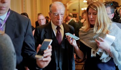 Sen. Chuck Grassley, R-Iowa, center, is questioned by reporters on Capitol Hill in Washington, Wednesday, Nov. 14, 2018, in Washington. Grassley will serve as Senate pro tempore, which means he will preside over the Senate in the Vice President&#39;s absence and is third in line of presidential succession. (AP Photo/Pablo Martinez Monsivais)