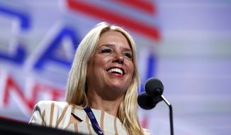 Then-Florida Attorney General Pam Bondi checks out the stage before the second-day session of the Republican National Convention in Cleveland, Tuesday, July 19, 2016. (AP Photo/Carolyn Kaster) ** FILE **