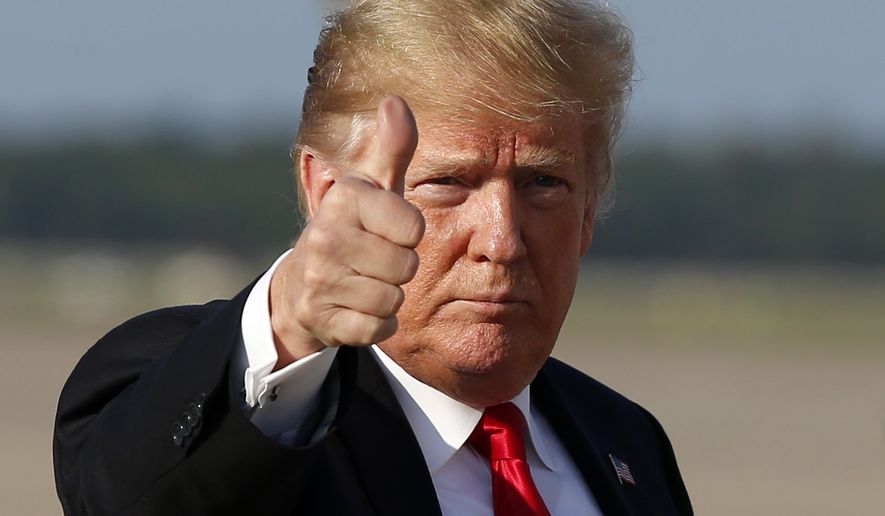 President Donald Trump gives thumbs up as he steps off Air Force One as he arrives Monday, Oct. 8, 2018, at Andrews Air Force Base, Maryland. (AP Photo/Alex Brandon) ** FILE **