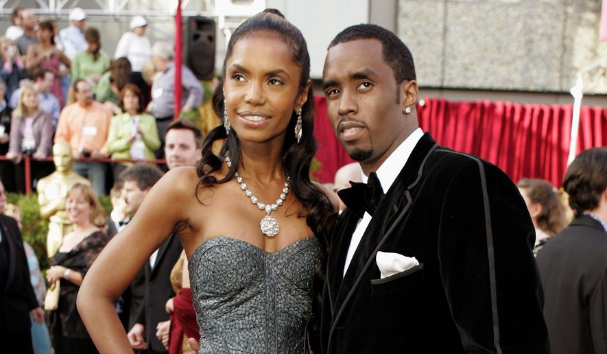FILE - In a Feb. 27, 2005 file photo, Sean &amp;quot;P. Diddy&amp;quot; Combs arrives with date, Kim Porter, for the 77th Academy Awards in Los Angeles. Sean “Diddy” Combs on Sunday, Nov. 18, 2018 is making his first public statements since the loss of longtime former girlfriend and mother of three of his children Kim Porter, saying they were “more than best friends,” and “more than soul mates.” Porter, a former model and actress, died in her home Thursday, Nov. 15 at age 47. (AP Photo/Amy Sancetta, File)
