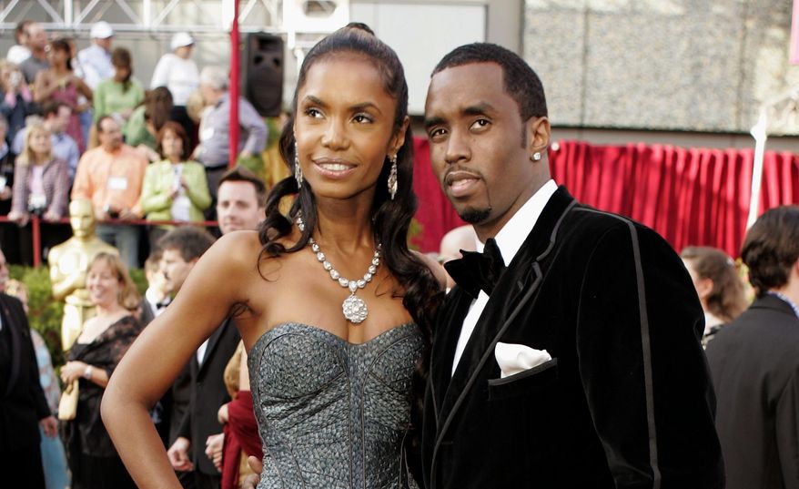 FILE - In a Feb. 27, 2005 file photo, Sean &amp;quot;P. Diddy&amp;quot; Combs arrives with date, Kim Porter, for the 77th Academy Awards in Los Angeles. Sean “Diddy” Combs on Sunday, Nov. 18, 2018 is making his first public statements since the loss of longtime former girlfriend and mother of three of his children Kim Porter, saying they were “more than best friends,” and “more than soul mates.” Porter, a former model and actress, died in her home Thursday, Nov. 15 at age 47. (AP Photo/Amy Sancetta, File)