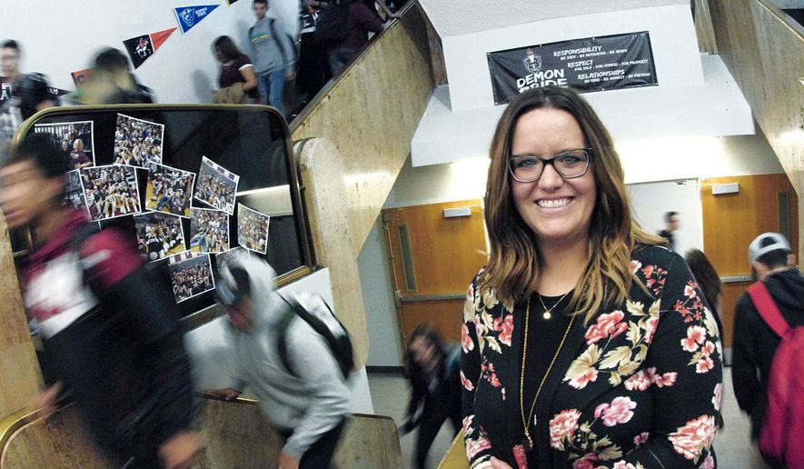 ADVANCE FOR USE MONDAY, NOV. 19, AND THEREAFTER Megan Kraft, a clinical physiologist at The Village in Bismarck, N.D., visits Bismarck High School once a week to help referred students with a range of mental health issues from stress to anxiety and depression. Photo taken on 10-17-2018. (Mike McCleary/The Bismarck Tribune via AP)