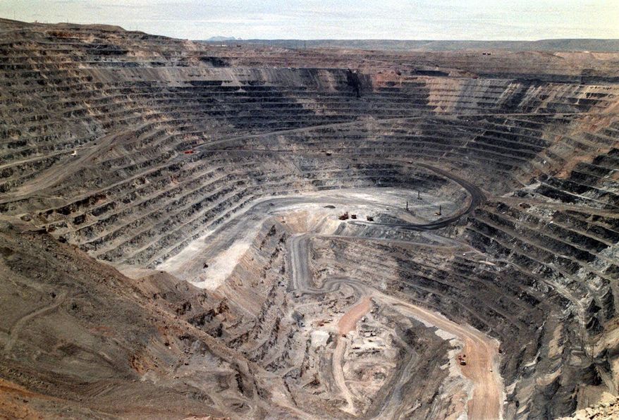 FILE - This undated file photo shows Barrick Goldstrike Mines' Betze-Post open pit near Carlin, Nev. A think tank and an advocacy group say Nevada could adapt old mines and former industrial sites to meet an aggressive clean energy benchmark that voters have endorsed with a statewide initiative. (Adella Harding/Elko Daily Free Press via AP, File)