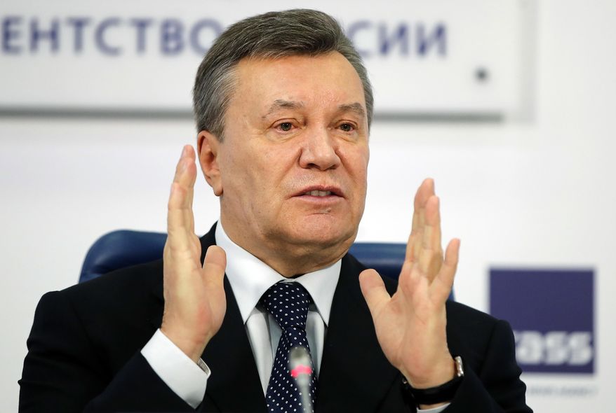 FILE - In this March 2, 2018 file photo, former Ukraine President Viktor Yanukovych gestures as he speaks at a news conference in Moscow. A lawyer representing Yanukovych said on Sunday, Nov. 18, 2018, that his client will be unable to appear before a Kiev court because of injuries sustained on a Moscow tennis court. (AP Photo/Pavel Golovkin, File)
