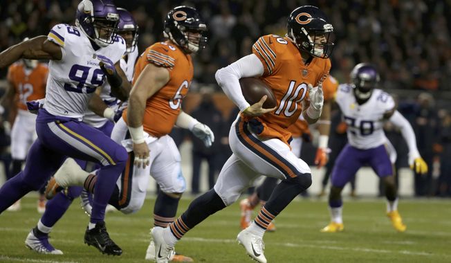 Chicago Bears quarterback Mitchell Trubisky (10) runs during the first half of an NFL football game against the Minnesota Vikings Sunday, Nov. 18, 2018, in Chicago. (AP Photo/David Banks)