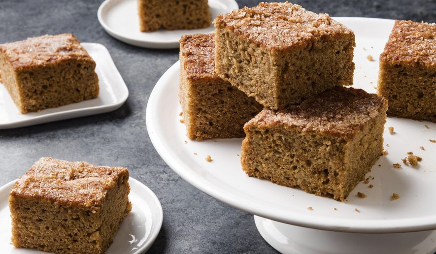 This undated photo provided by America's Test Kitchen in October 2018 shows applesauce snack cake in Brookline, Mass. This recipe appears in the cookbook "Perfect Cake." (Joe Keller/America's Test Kitchen via AP)