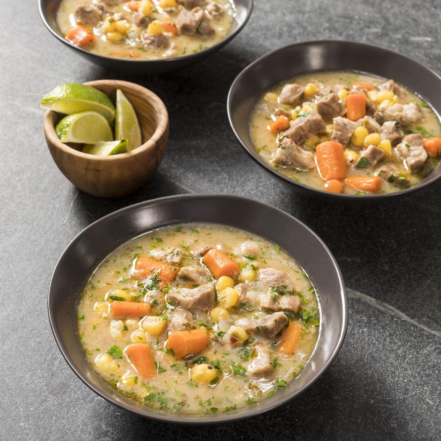 This undated photo provided by America's Test Kitchen in October 2018 shows chipotle pork and hominy stew in Brookline, Mass. This recipe appears in the cookbook “Multicooker Perfection.” (Daniel J. van Ackere/America's Test Kitchen via AP)