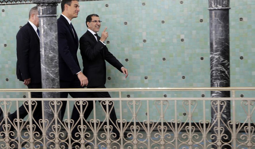 Morocco's Prime Minister Saad Eddine el-Othmani, right, greets his Spanish counterpart Pedro Sanchez prior to their meeting, in Rabat, Morocco, Monday, Nov, 19, 2018. (AP Photo)