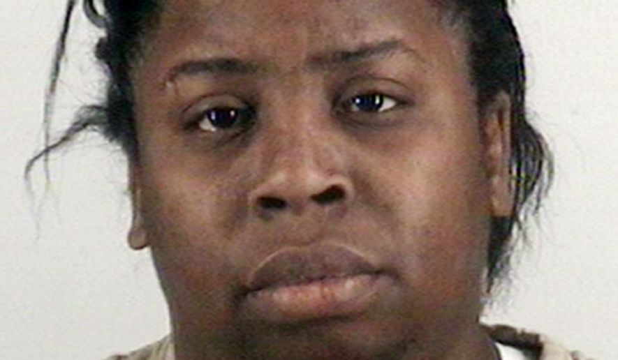 This photo proved by the Tarrant County Sheriff's Office in Fort Worth, Texas, show Shamonica Page, a caregiver who has been charged with injury to a child. Police in the Fort Worth area say a 2-year-old girl died after Page hit her with a belt and burned her buttocks for discipline. (Tarrant County Sheriff's Office via AP)