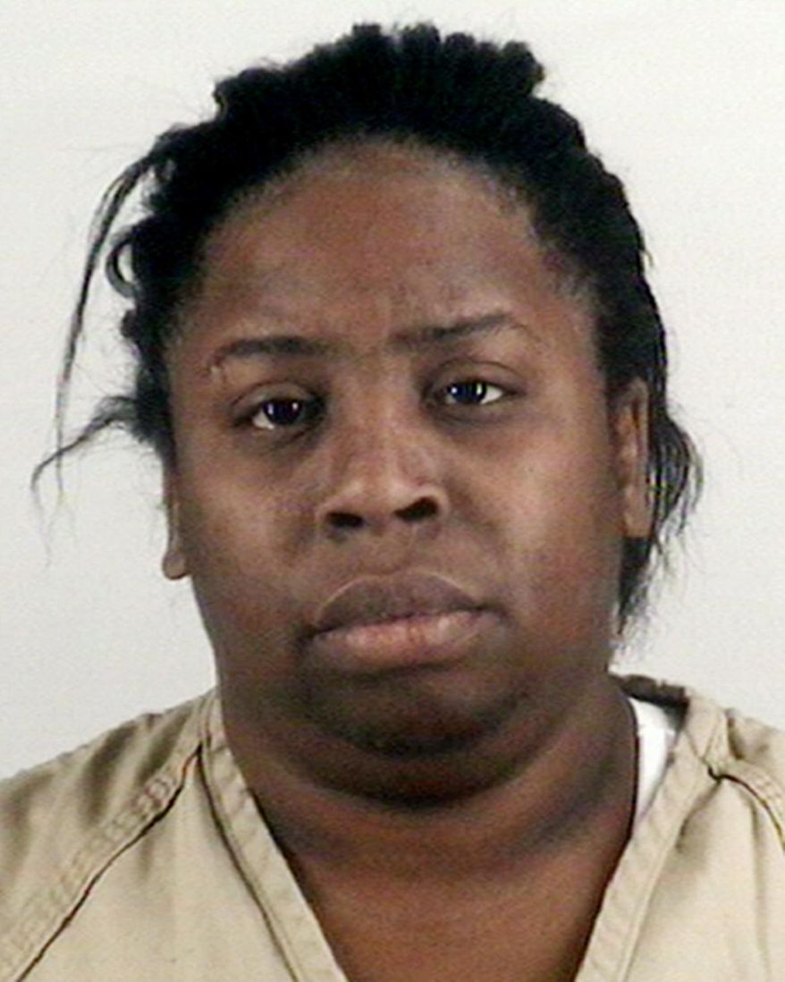This photo proved by the Tarrant County Sheriff's Office in Fort Worth, Texas, show Shamonica Page, a caregiver who has been charged with injury to a child. Police in the Fort Worth area say a 2-year-old girl died after Page hit her with a belt and burned her buttocks for discipline. (Tarrant County Sheriff's Office via AP)