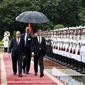 Russian Prime Minister Dmitry Medvedev, center right, and his Vietnamese counterpart Nguyen Xuan Phuc review an honor guard in Hanoi, Vietnam, Monday, Nov. 19, 2018. Medvedev is in Vietnam for a two-day visit to boost ties between the two countries. (Hoang Thong Nhat/Vietnam News Agency via AP)