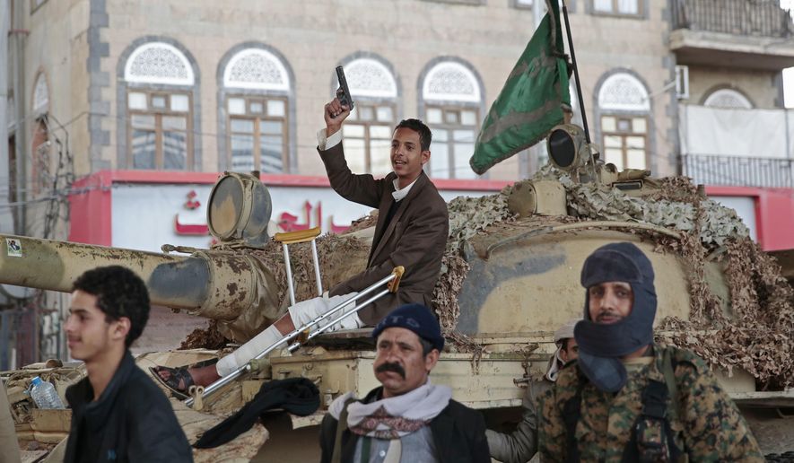 In this Dec. 4, 2017, file photo, Houthi Shiite fighters guard a street leading to the residence of former Yemeni President Ali Abdullah Saleh, in Sanaa, Yemen. (AP Photo/Hani Mohammed, File)
