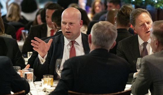 Acting U.S. Attorney General Matthew Whitaker, left, dines with other officials, Tuesday, Nov. 20, 2018, in New York. Before joining the Justice Department, Whitaker earned nearly $1 million from a right-leaning nonprofit that doesn&#39;t disclose its donors, according to financial disclosure forms released Tuesday. (AP Photo/Craig Ruttle)