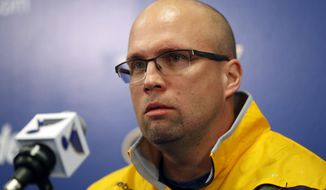 FILE - In this Feb. 1, 2017, file photo, Mike Yeo listens to a question during a news conference after being named the new head coach of the St. Louis Blues in St. Louis.  Early Tuesday, Nov. 20, 2018, Blues general manager Doug Armstrong announced that the team has fired Yeo and named Craig Berube as his interim replacement. (AP Photo/Jeff Roberson, File)