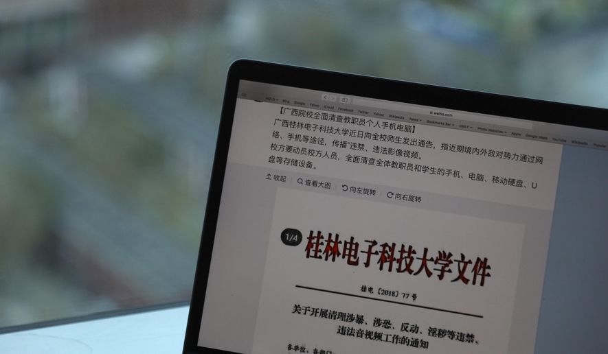 In this file photo taken Thursday, Nov. 15, 2018, a computer screen shows the leaked online post from Guilin University of Electronic Technology warning of &amp;quot;hostile domestic and foreign powers&amp;quot; that were &amp;quot;wantonly spreading illicit and illegal videos&amp;quot; through the internet in Beijing, China. The Chinese university’s plan to conduct a blanket search of student and staff electronic devices has come under fire, illustrating the limits of the population’s tolerance for surveillance and raising concern that tactics used on China’s Muslim minorities may be creeping into the rest of the country. (AP Photo/Ng Han Guan) ** FILE **