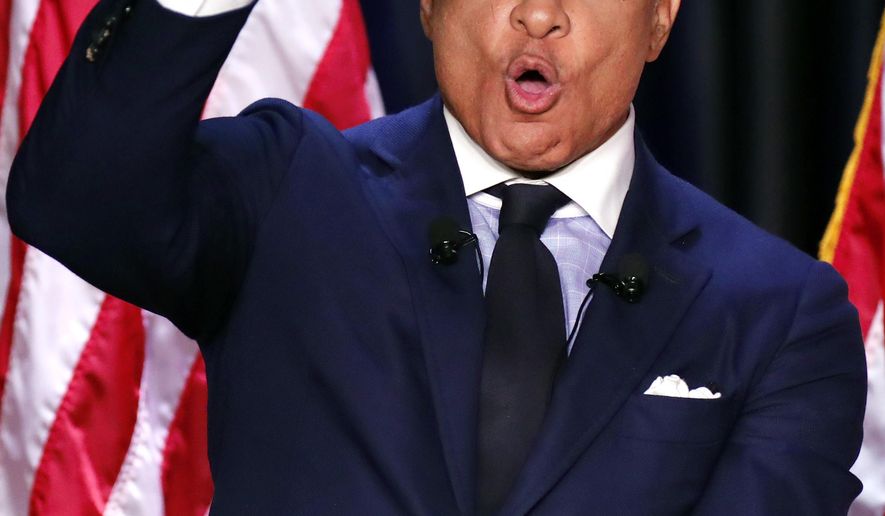 Democrat Mike Espy responds to a statement from his opponent, appointed U.S. Sen. Cindy Hyde-Smith, R-Miss., during a televised Mississippi U.S. Senate debate in Jackson, Miss., Tuesday, Nov. 20, 2018. (AP Photo/Rogelio V. Solis, POOL)