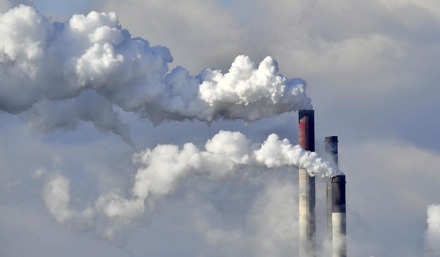FILE - In this Feb. 27, 2018 file photo a coal-fired power station steams in the cold winter air in Gelsenkirchen, Germany. Environmental groups say 10 utility companies are responsible for the majority of premature deaths caused by emissions from coal-fired power plants in Europe. In a report published Tuesday, Nov. 20, 2018 five campaign groups, including Greenpeace, blame the companies for 7,600 premature deaths and millions of work days lost across Europe in 2016. (AP Photo/Martin Meissner, file)