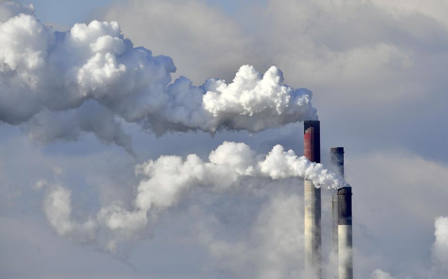 FILE - In this Feb. 27, 2018 file photo a coal-fired power station steams in the cold winter air in Gelsenkirchen, Germany. Environmental groups say 10 utility companies are responsible for the majority of premature deaths caused by emissions from coal-fired power plants in Europe. In a report published Tuesday, Nov. 20, 2018 five campaign groups, including Greenpeace, blame the companies for 7,600 premature deaths and millions of work days lost across Europe in 2016. (AP Photo/Martin Meissner, file)