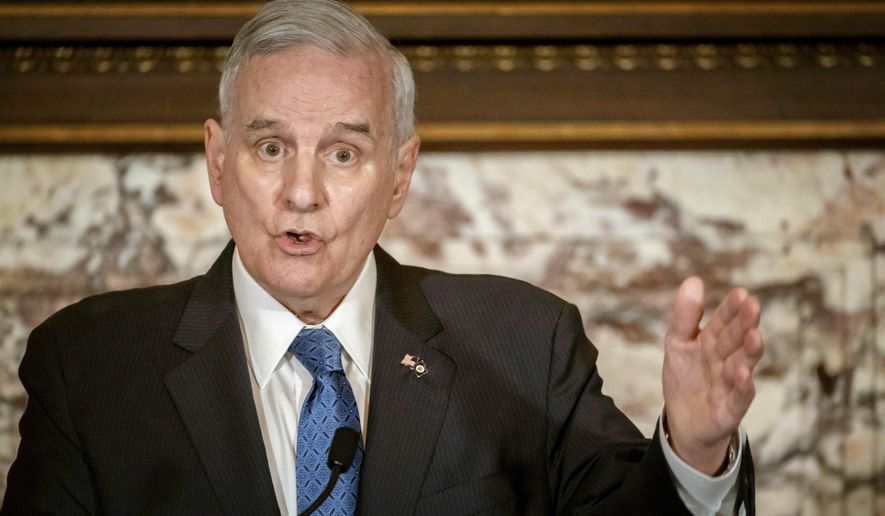 FILE - In this May 23, 2018, file photo, Minnesota Gov. Mark Dayton speaks at a press conference in St. Paul, Minn. Dayton says he expects to be home before Thanksgiving after complications from back surgery required more than a month of hospitalization. Dayton hasn&#39;t been seen publicly since before his first surgery on Oct. 12. (Glen Stubbe/Star Tribune via AP, File)