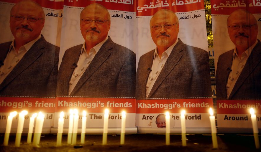 FILE - In this Oct. 25, 2018, file photo, candles, lit by activists, protesting the killing of Saudi journalist Jamal Khashoggi, are placed outside Saudi Arabia&#39;s consulate, in Istanbul, during a candlelight vigil. President Donald Trump is facing mounting pressure to sternly rebuke Saudi Arabia over the death of Khashoggi. So far, Trump is resisting calls to harshly reprimand the close U.S. ally.  (AP Photo/Lefteris Pitarakis, File)