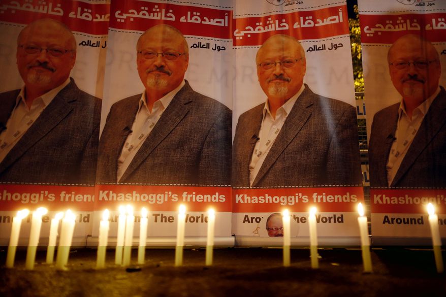 FILE - In this Oct. 25, 2018, file photo, candles, lit by activists, protesting the killing of Saudi journalist Jamal Khashoggi, are placed outside Saudi Arabia&#39;s consulate, in Istanbul, during a candlelight vigil. President Donald Trump is facing mounting pressure to sternly rebuke Saudi Arabia over the death of Khashoggi. So far, Trump is resisting calls to harshly reprimand the close U.S. ally.  (AP Photo/Lefteris Pitarakis, File)