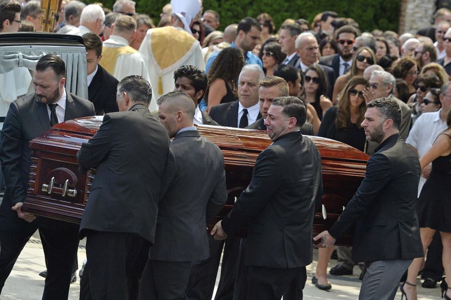 FILE - In this Aug. 6, 2016 file photo, mourners carry the casket of Karina Vetrano from St. Helen's Church following her funeral in the Howard Beach section of the Queens borough of New York. The trial of a man accused of killing Vetrano, a New York City woman who was sexually attacked while jogging near her family's home, has ended in a hung jury. A judge late Tuesday, Nov. 20, 2018, granted a mistrial after the jury said it was split after just a day and a half of deliberations. (Steven Sunshine/Newsday via AP, File)