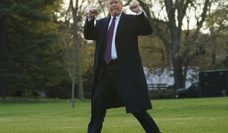 President Donald Trump gestures as he walks to Marine One after speaking to media at the White House in Washington, Tuesday, Nov. 20, 2018, for the short trip to Andrews Air Force Base en route to Palm Beach International Airport, in West Palm Beach, Fla., and on to and onto Mar-a-Lago. (AP Photo/Carolyn Kaster)