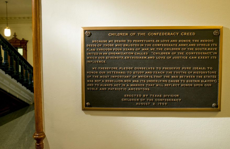 FILE - This Aug. 17, 2017 file photo shows, The Children of the Confederacy Creed plaque at the Capitol in Austin, Texas, on Thursday August 17, 2017. State Rep. Eric Johnson of Dallas, a black Democratic lawmaker, is renewing calls to immediately remove the Confederate plaque after the state's attorney general said that doing so doesn't require a legislative vote. (Jay Janner/Austin American-Statesman via AP, File)
