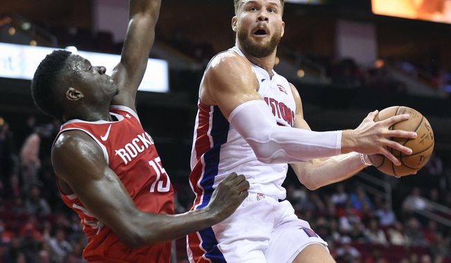 Detroit Pistons forward Blake Griffin, right, drives to the basket as Houston Rockets center Clint Capela defends during the first half of an NBA basketball game Wednesday, Nov. 21, 2018, in Houston. (AP Photo/Eric Christian Smith)