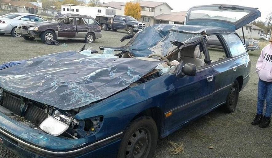 FILE - This Aug. 15, 2016, file photo shows a damaged vehicle belonging to Dori and Jack Garner. The couple suffered life-threatening injuries in a collision with rancher Jack Yantis' bull on Nov. 1, 2015. Jack Yantis died in 2015 after one of his bulls was hit by a car. Two deputies responded to the crash and Yantis arrived with a rifle. Authorities say there was an altercation and everyone involved fired their weapons. A federal wrongful death lawsuit filed by the family of an Idaho rancher who was fatally shot by sheriff's deputies has been dismissed. A judge tossed the lawsuit Tuesday, Nov. 20, 2018, amid an apparent settlement. (Katy Moeller/Idaho Statesman via AP, File)