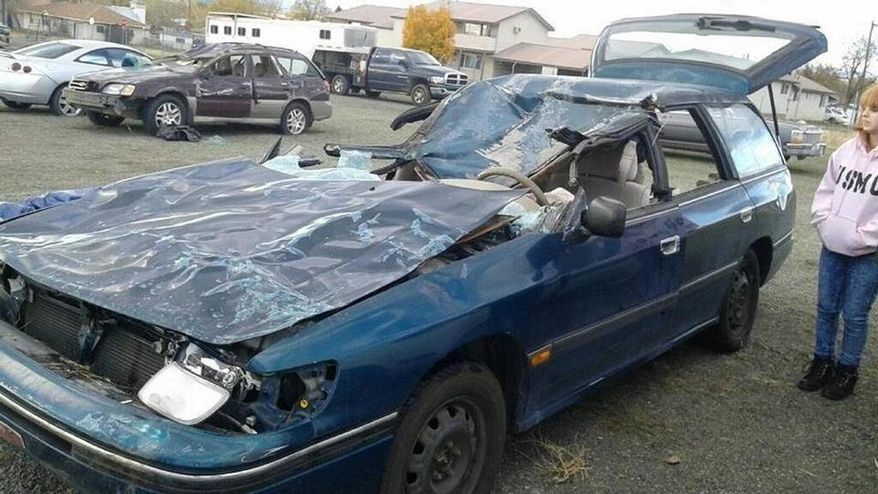 FILE - This Aug. 15, 2016, file photo shows a damaged vehicle belonging to Dori and Jack Garner. The couple suffered life-threatening injuries in a collision with rancher Jack Yantis' bull on Nov. 1, 2015. Jack Yantis died in 2015 after one of his bulls was hit by a car. Two deputies responded to the crash and Yantis arrived with a rifle. Authorities say there was an altercation and everyone involved fired their weapons. A federal wrongful death lawsuit filed by the family of an Idaho rancher who was fatally shot by sheriff's deputies has been dismissed. A judge tossed the lawsuit Tuesday, Nov. 20, 2018, amid an apparent settlement. (Katy Moeller/Idaho Statesman via AP, File)