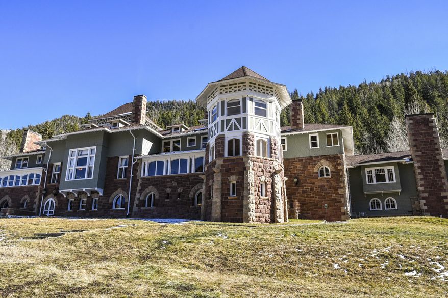 ADVANCE FOR USE THURSDAY, NOV. 22, 2018 - This Thursday, Nov. 15, 2018, photo, shows the exterior of the recently restored Redstone Castle in Redstone, Colo. The Redstone Castle is now open for tours and overnight stays for guests after many years of restoration work. (Chelsea Self/Glenwood Springs Post Independent via AP)