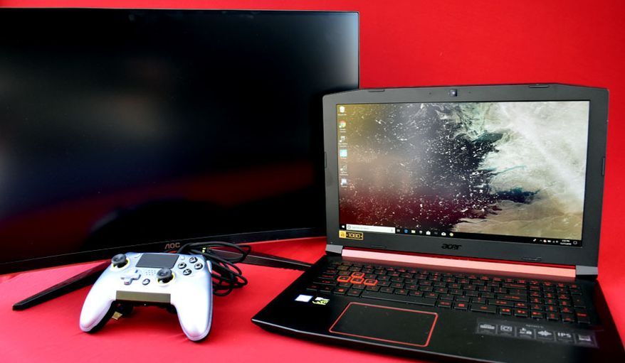 Coolest gaming gadgets and electronics include AOC Gaming's C27G1 curved monitor, Scuf's Vantage controller and Acer's Nitro 5 laptop. (Photograph by Joseph Szadkowski / The Washington Times)