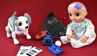 Spin Master&#39;s Zoomer and Boxer (center), PowerUp Toys&#39; X-FPV and Hasbro&#39;s Baby Alive. (Photograph by Joseph Szadkowski / The Washington Times)