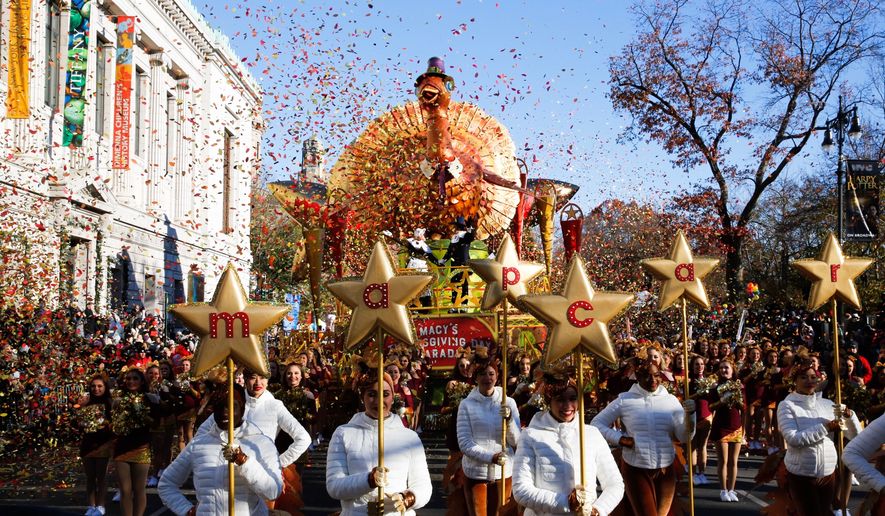People take part in the 92nd annual Macy's Thanksgiving Day Parade in New York, Thursday, Nov. 22, 2018. (AP Photo/Eduardo Munoz Alvarez)