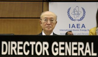 Director General of the International Atomic Energy Agency, IAEA, Yukiya Amano of Japan waits for the start of the IAEA board of governors meeting at the International Center in Vienna, Austria, Thursday, Nov. 22, 2018. (AP Photo/Ronald Zak)
