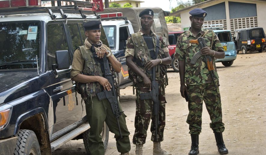 Kenyan police stand guard inside the compound of the command centre that is directing operations in the search for kidnapped Italian volunteer Silvia Costanza Romano, in Malindi, Kenya Thursday, Nov. 22, 2018. Gunmen firing indiscriminately on Tuesday kidnapped Romano, a 23-year-old volunteer working with Kenyan students, from the village of Chakama in Kilifi county. (AP Photo)
