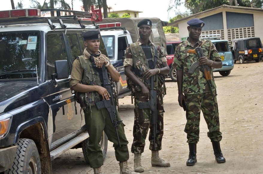Kenyan police stand guard inside the compound of the command centre that is directing operations in the search for kidnapped Italian volunteer Silvia Costanza Romano, in Malindi, Kenya Thursday, Nov. 22, 2018. Gunmen firing indiscriminately on Tuesday kidnapped Romano, a 23-year-old volunteer working with Kenyan students, from the village of Chakama in Kilifi county. (AP Photo)