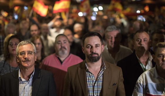 In this Wednesday, Nov. 14, 2018 photo, Spain&#x27;s far-right Vox Party President Santiago Abascal, centre, takes part in a party rally in Murcia, Spain. Vox is reaching out to the neglected, working-class suburbs and rural areas with high unemployment, as polls are widely predicting the Eurosceptic, anti-feminist and staunchly patriotic party is on track to enter the country’s parliament in elections due before 2020. (AP Photo/Emilio Morenatti)